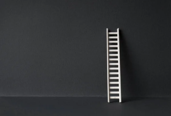 White Ladder Leaning Dark Wall Background Copy Space — Stock Photo, Image