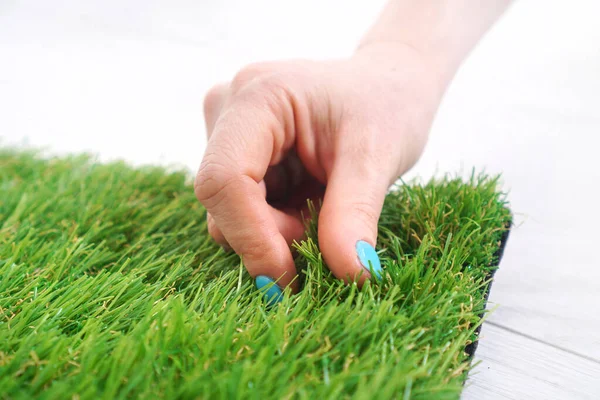 Woman Hand Touches Artificial Turf — 스톡 사진