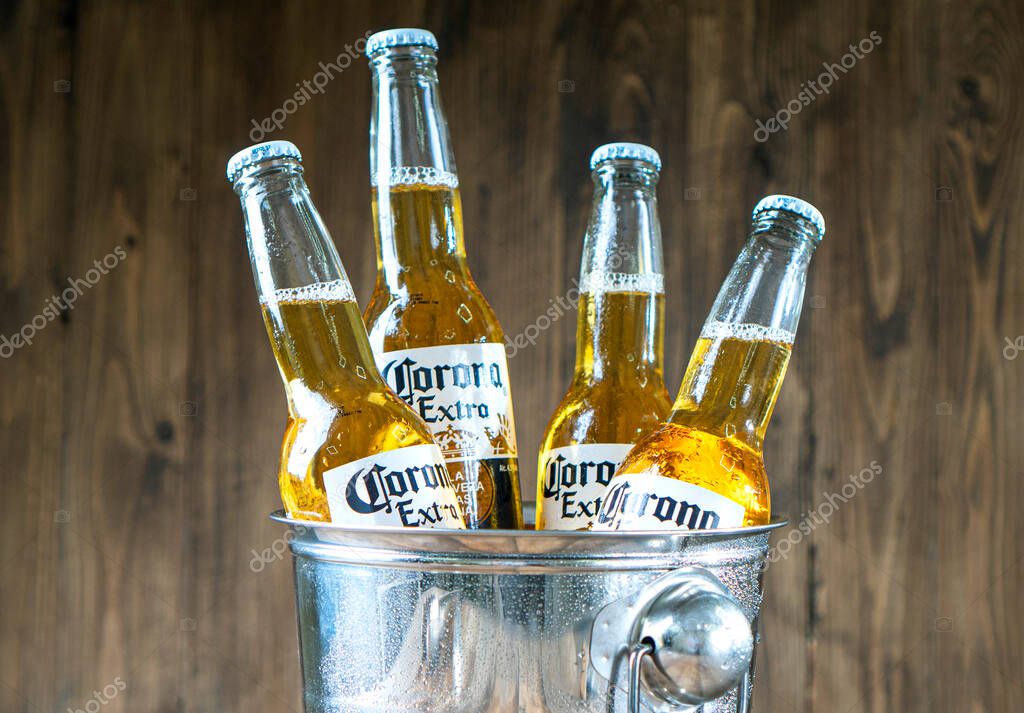 KHARKIV, UKRAINE - 30 June, 2020: Illustrative editorial of Corona Beer bottles close-up in a stainless steel bucket