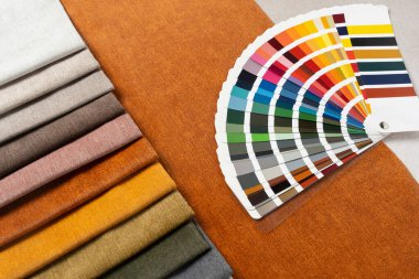 Fabric swatches with color palette samples for upholstery, home decor, and modern textile interior design projects.