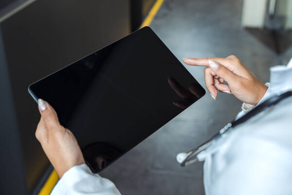 Doctor using tablet for medical data. Modern healthcare technology and telemedicine concept.