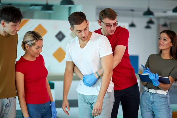 man instructor showing how to safe a life when the human is choked