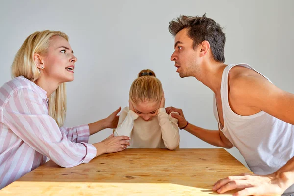 Kid daughter feeling upset while parents are quarrelling — Stock Photo, Image