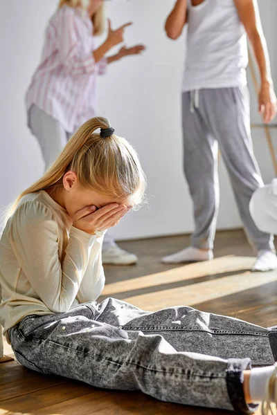 Kid daughter feeling upset while parents are quarrelling — Stock Photo, Image