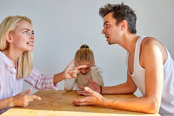 Portrait of caucasian man and woman having quarrel, kid girl is tired hearing their arguing — Stock Photo, Image