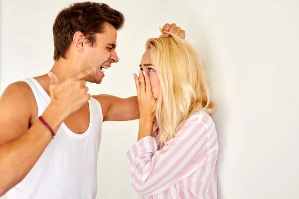 Family violence - aggressive and nervous man arguing with his wife at home — Stock Photo, Image