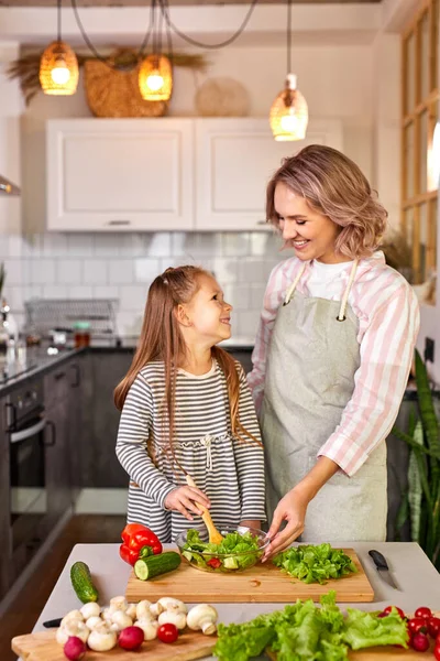 Portrait of caucasian family mother with daughter cooking together — Stock Photo, Image