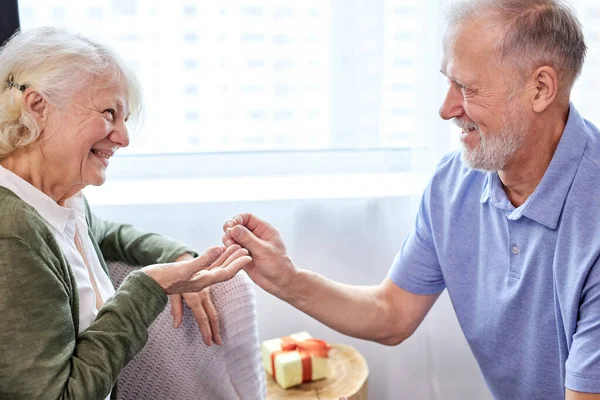 Proposal. senior man making a proposal and a happy woman smiling — Stock Photo, Image