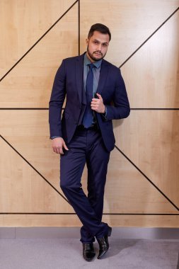 good-looking executive in formal wear posing, after meeting