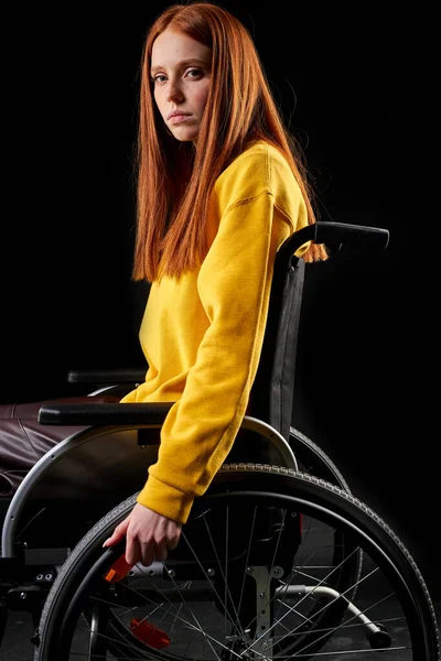 Side view on sad disabled woman in a wheelchair — Stock Photo, Image