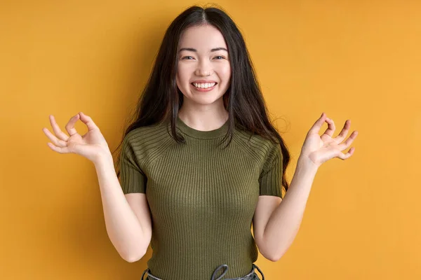 Cheerful female concentrated on meditation, keep calm isolated in studio — Stock Photo, Image