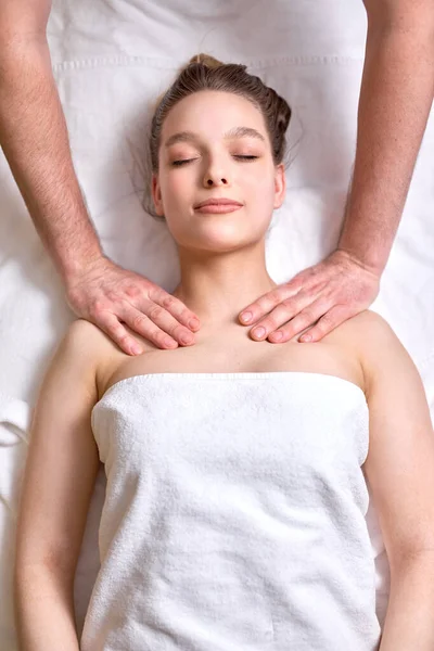 Relaxing Massage. Top view Female Receiving Shoulders And Neck Massage At Spa Salon — Zdjęcie stockowe