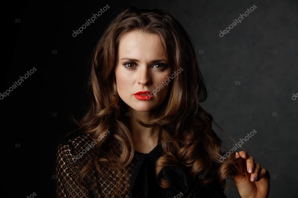 Portrait Of Woman With Long Wavy Brown Hair And Red Lips