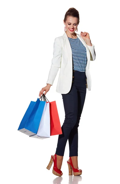 Mujer joven sonriente con bandera francesa colores bolsas de compras —  Fotos de Stock