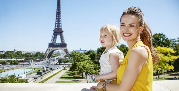 mother and daughter travellers in Paris looking into distance