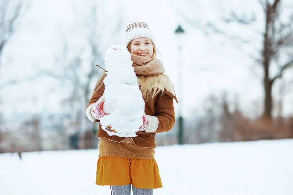 Happy Stylish Girl Knitted Hat Sheepskin Coat Mittens Snowman Outdoors — Stock Photo, Image