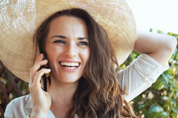 Happy Young Woman White Shirt Hat Speaking Smartphone Terrace — Stock Photo, Image
