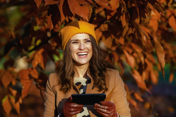 Hello October Smiling Young Woman Beige Coat Orange Hat Using — Stock Photo, Image