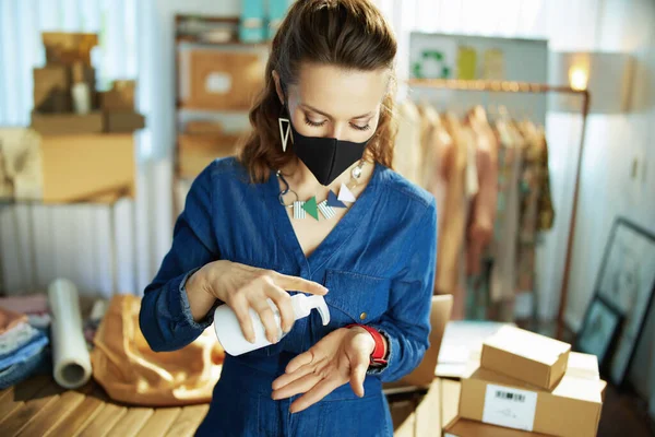 Young Small Business Owner Woman Black Mask Disinfecting Hands Sanitizer — Stock Photo, Image