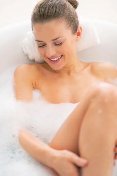 Young woman laying in bathtub — Stock Photo, Image