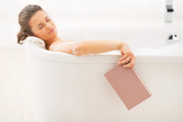 Young woman fall asleep while reading book in bathtub — Stock Photo, Image