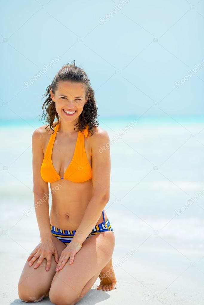 Portrait of young woman on sea shore