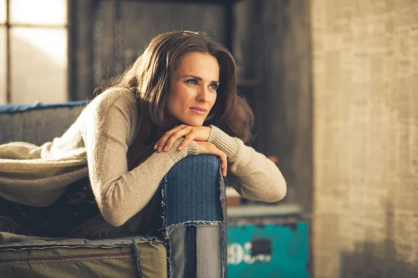 Portrait of thoughtful young woman in loft apartment — Stock Photo, Image