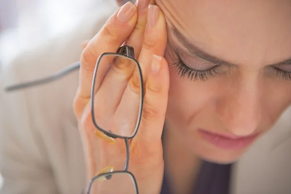 Closeup on stressed business woman with eyeglasses — Stock Photo, Image