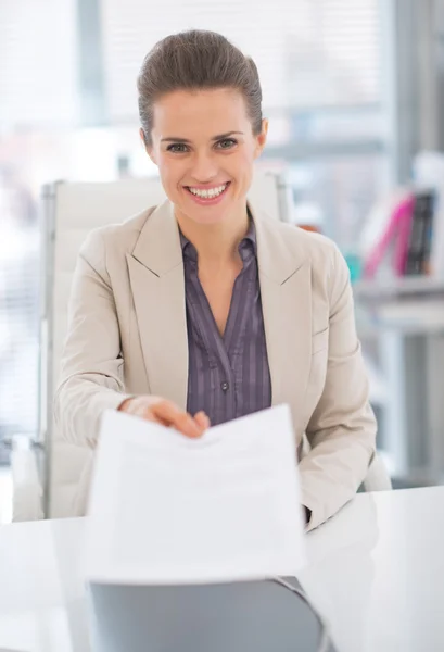 Portrait of happy business woman giving document — Stock Photo, Image