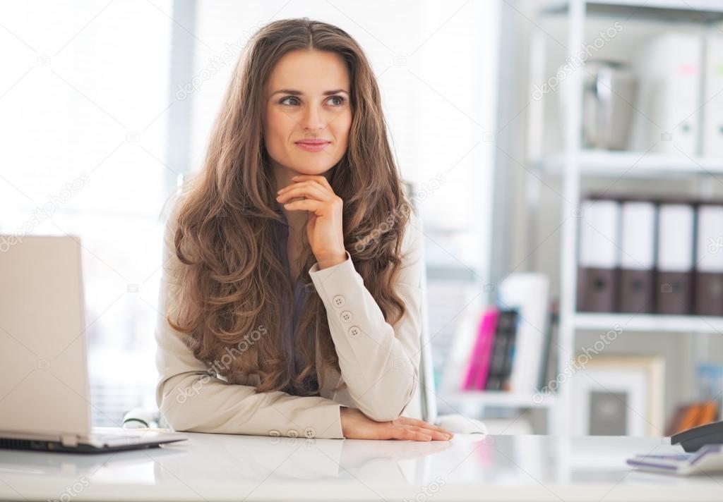 Portrait of happy business woman at work