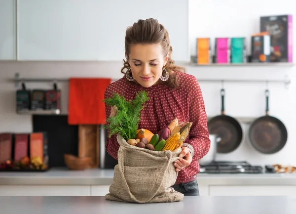 Young housewife enjoying freshness of local market purchases — Stock Photo, Image