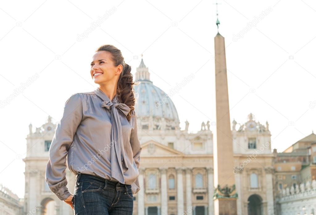 Happy young woman sightseeing on piazza san pietro in vatican ci