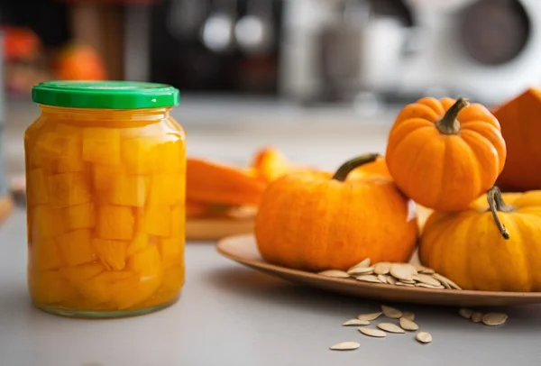 Closeup on jar of pickled pumpkin on table — Stock Photo, Image