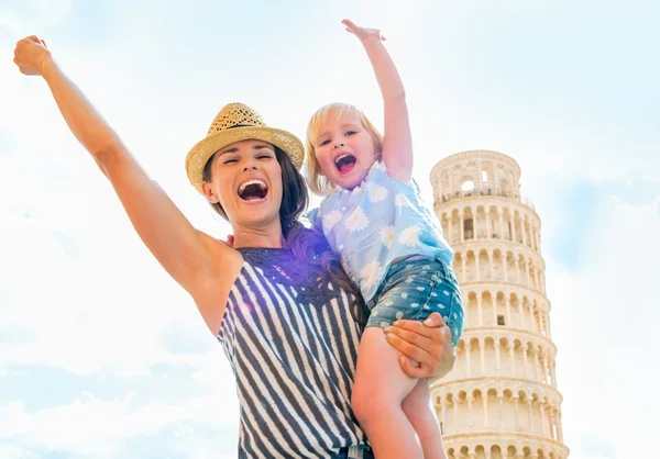 Portrait of happy mother and baby girl rejoicing in front of lea — Stock Photo, Image