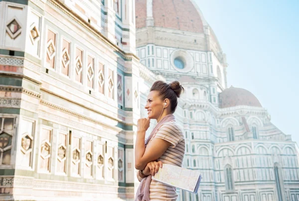 Woman with map standing