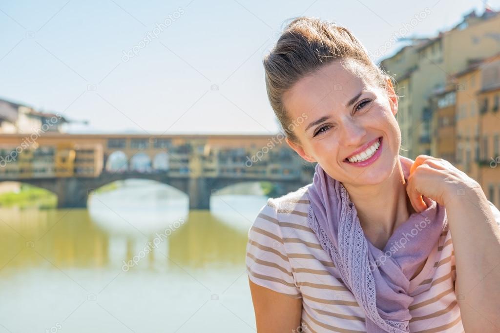 Woman sitting on bridge