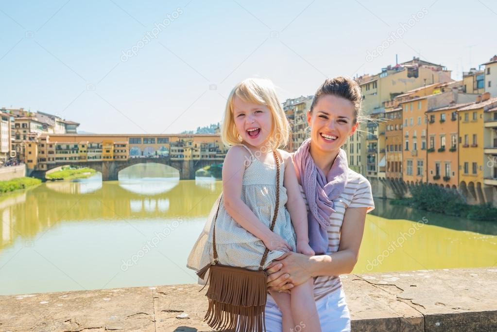 Mother and  girl standing