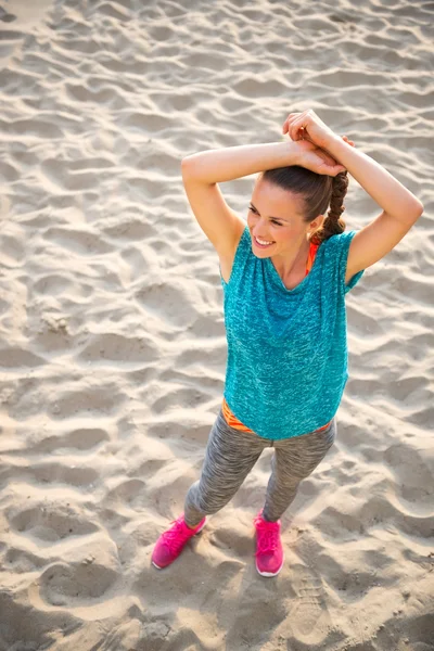 Happy fitness young woman on beach — Stock Photo, Image