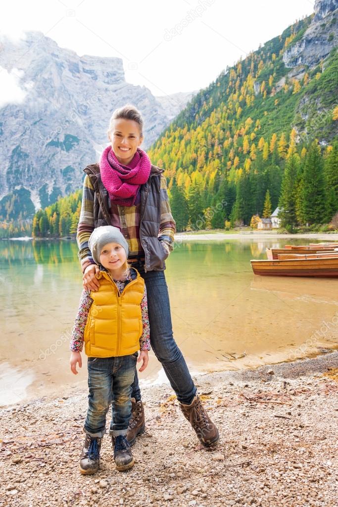 Mother and daughter together smiling at Lake Bries