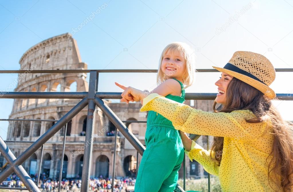 Mother and daughter tourists at the Colosseum in Rome