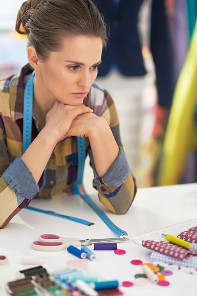 Portrait of stressed tailor woman at work — Stock Photo, Image