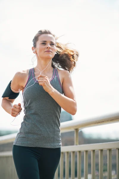 Fitness young woman jogging in the city — Stock Photo, Image