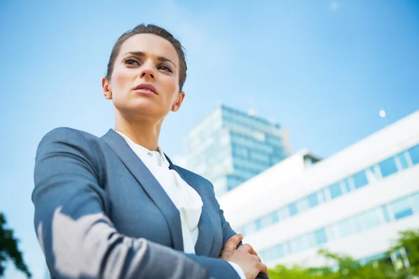 Portrait of serious business woman in front of office building — Stok fotoğraf