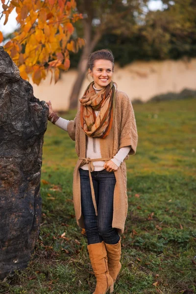 Happy young woman in autumn outdoors in evening — Stock Photo, Image