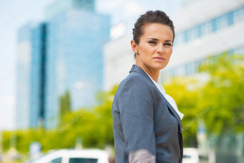 Portrait of confident business woman in office district