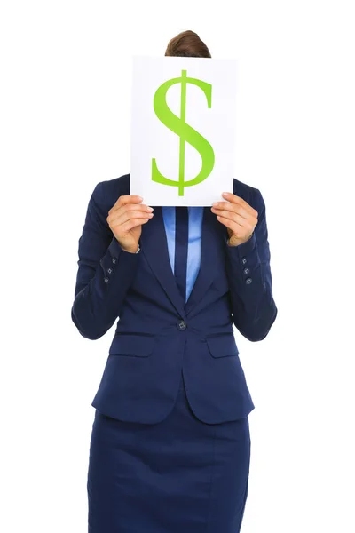 Businesswoman holding dollar sign in front of face — Stock Photo, Image