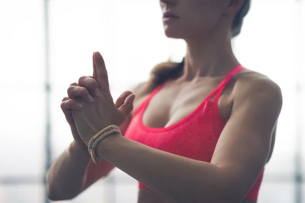 Partial view closeup of fit woman's hands in yoga pose — Stock Photo, Image