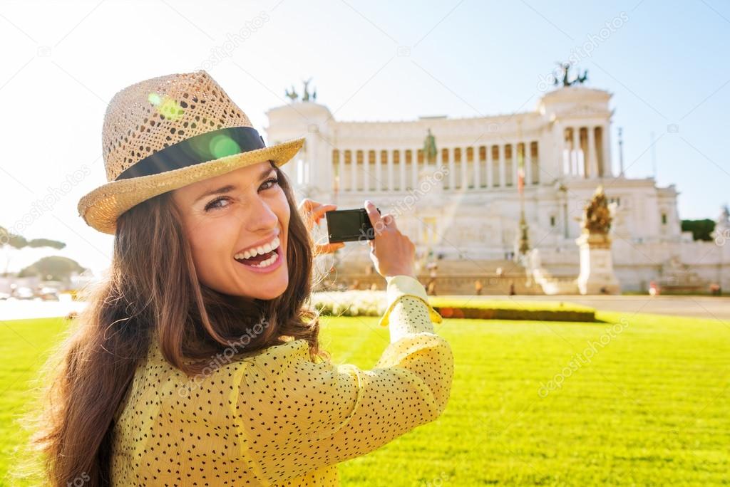 Laughing woman taking photo of Venice Square monument