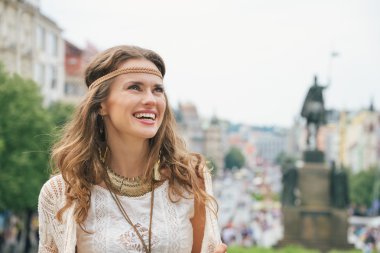 Portrait of longhaired hippy-looking woman tourist  in Prague