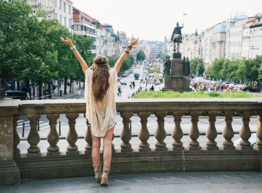 Seen from behind, hippy-looking woman on Saint Wenceslas, Prague